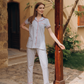 Classic women's pajamas with buttons, a pocket on the chest