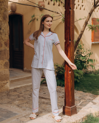Classic women's pajamas with buttons, a pocket on the chest