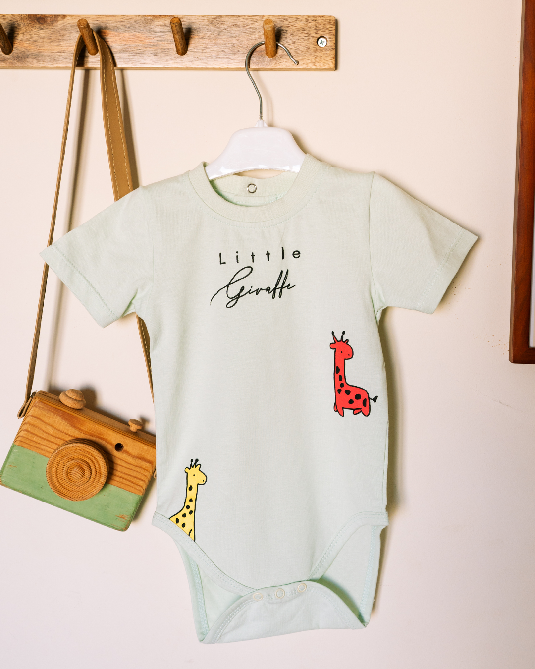 Children's romper with a cute giraffe print