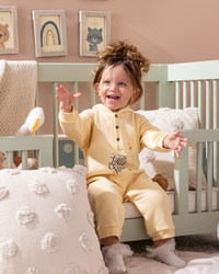 Sky baby jumpsuit with printed hood