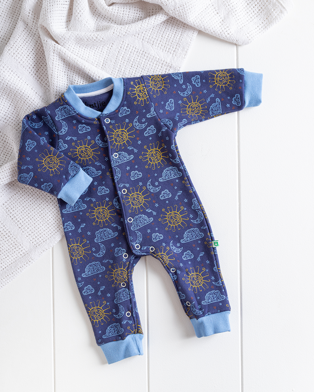 My children's jumpsuit with clouds, sun and moon