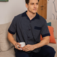 Classic men's pajamas with open half-sleeve buttons and diamond trousers