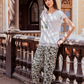 Women's pajamas with a half-sleeved top and a lace print and olive-rose trousers