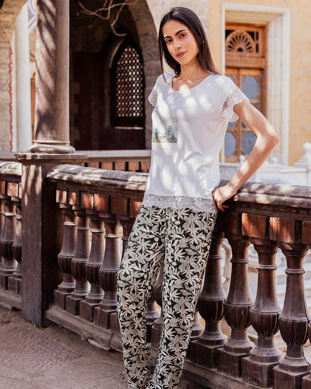 Women's pajamas with a half-sleeved top and a lace print and olive-rose trousers