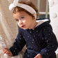 Shine Stars Baby girls zip-up jumpsuit with a fur-lined cabochon