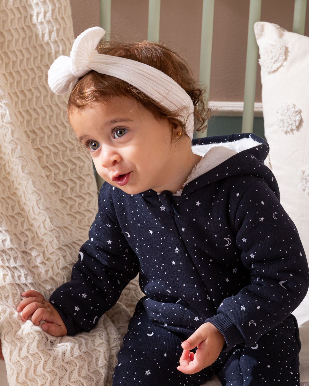 Shine Stars Baby girls zip-up jumpsuit with a fur-lined cabochon