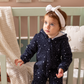 Shine Stars Baby girls zip-up jumpsuit with a fur-lined cabochon