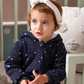 Shine Stars Baby girls zip-up jumpsuit with a fur-lined cabochon