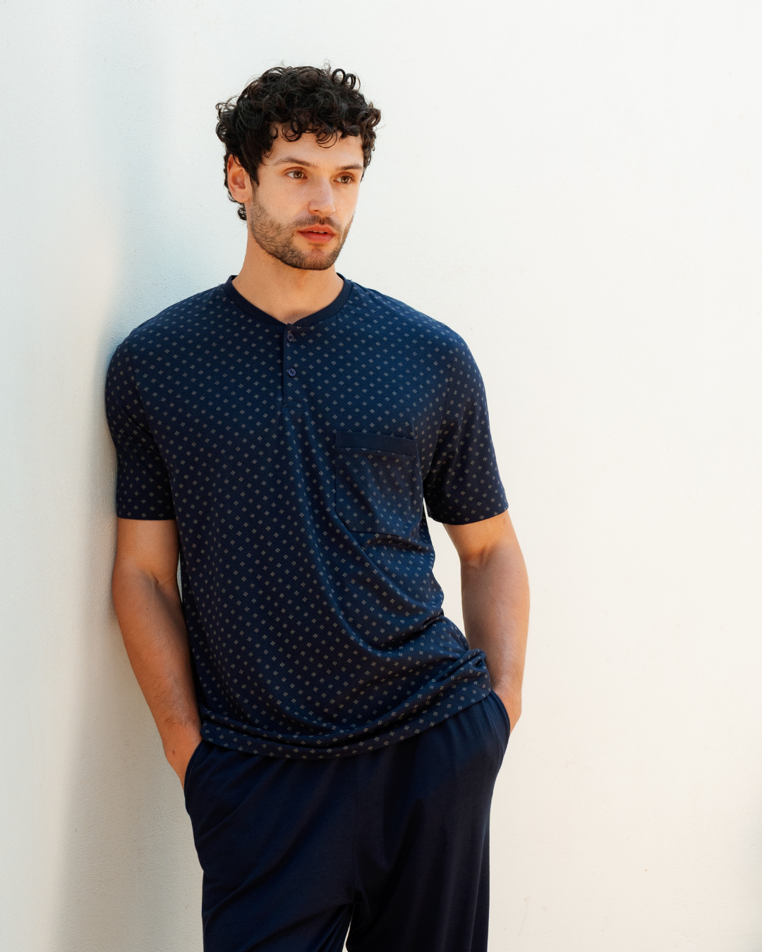 Man with an elegant classic look in a pajama with a distinctive geometric pattern