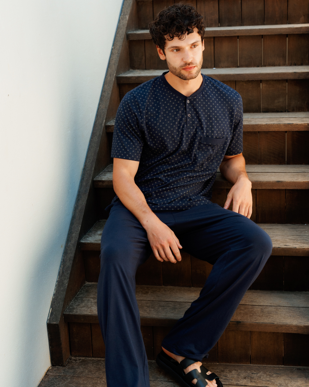 Man with an elegant classic look in a pajama with a distinctive geometric pattern