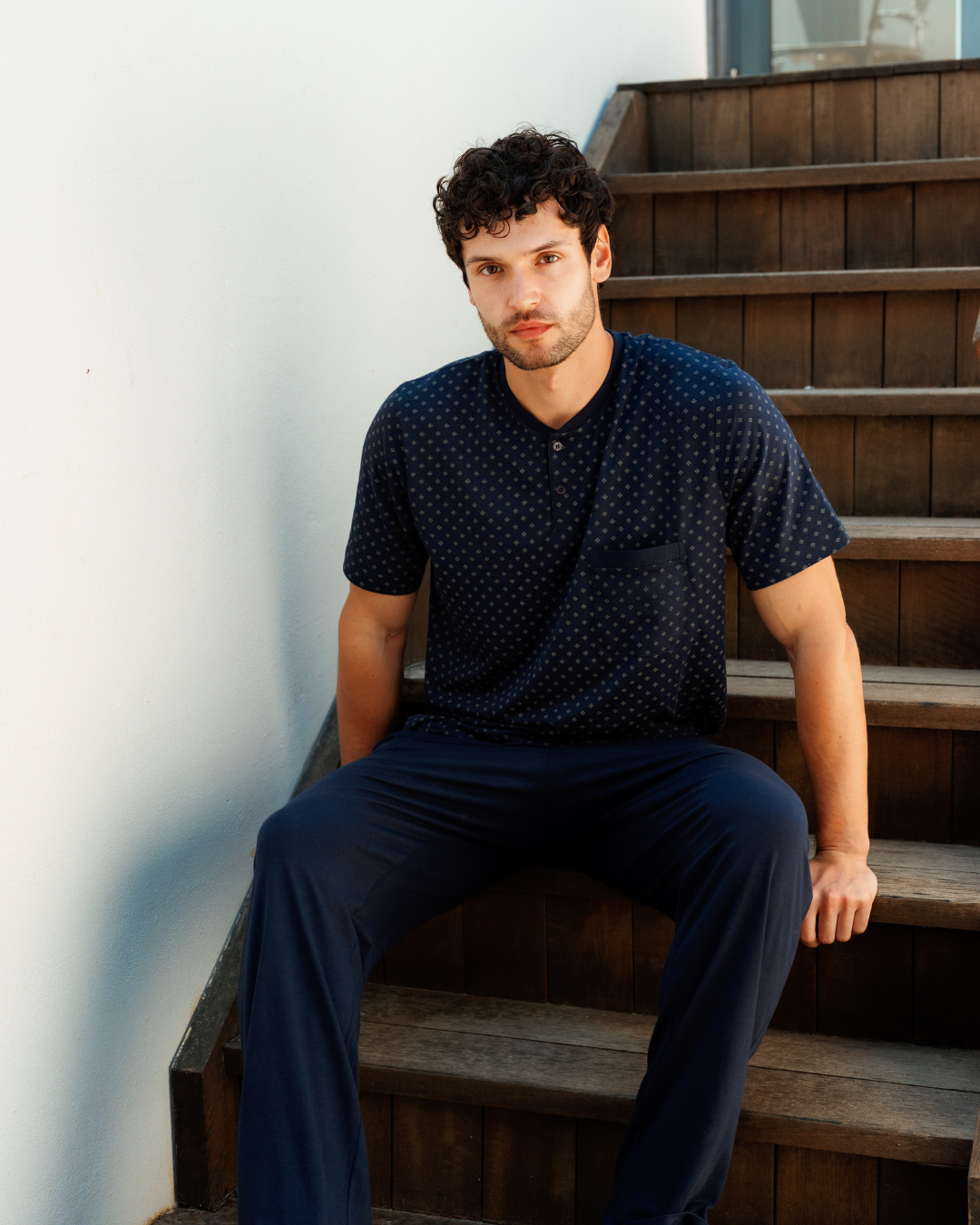 Man with an elegant classic look in a pajama with a distinctive geometric pattern