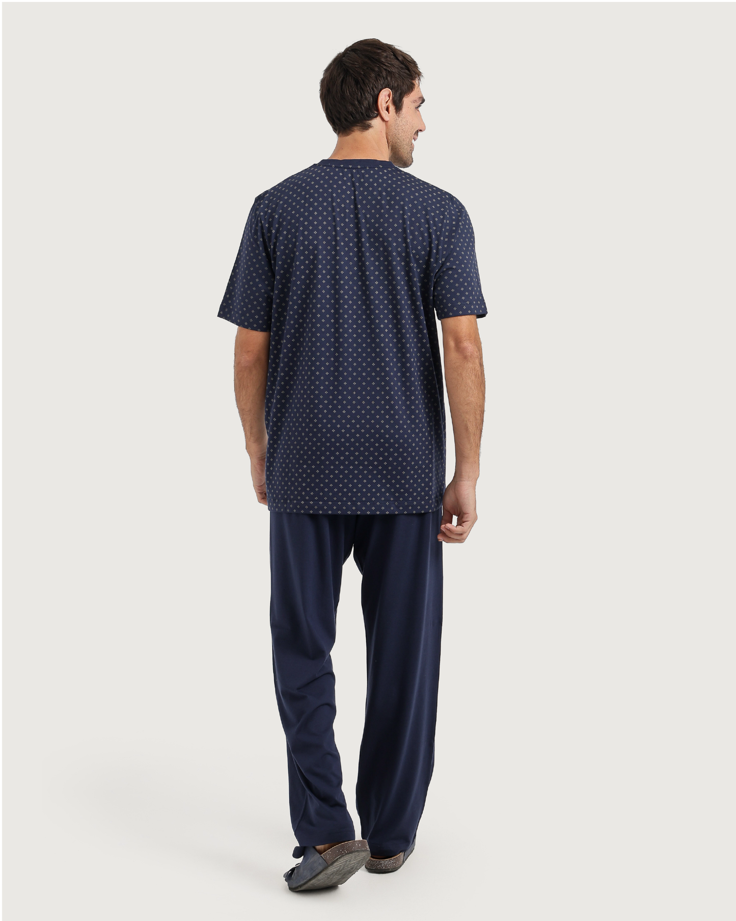 Man with an elegant classic look in a pajama with a distinctive geometric pattern