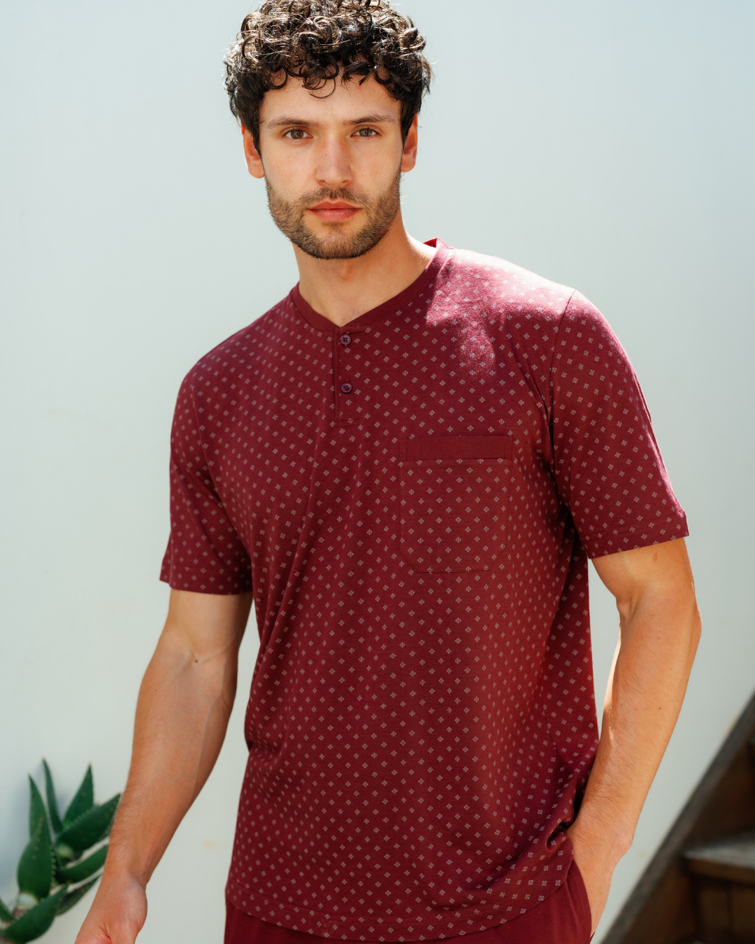 Man with an elegant classic look in a pajama with a distinctive geometric pattern