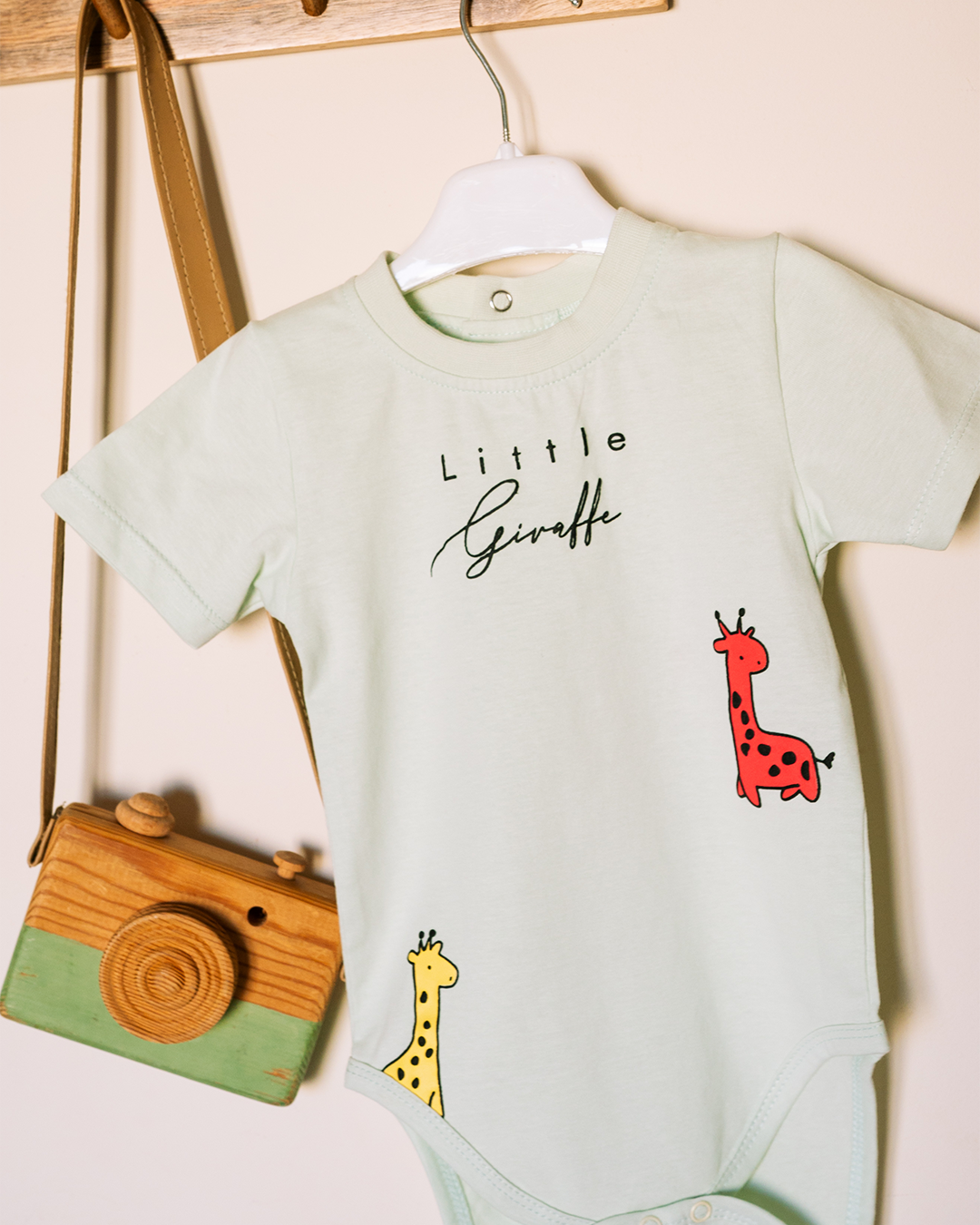 Children's romper with a cute giraffe print