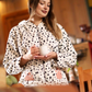 Women's jumpsuit dotted with cape