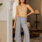 Women's pajamas, long open floral trousers, a cut-out T-shirt with embroidery and a flower on the chest