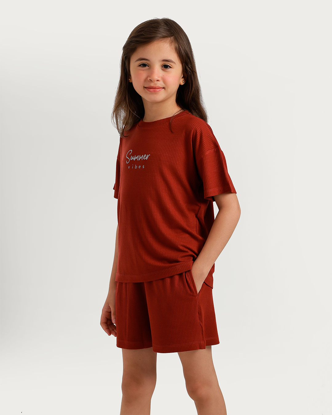 Cute girl in warm-colored pajamas