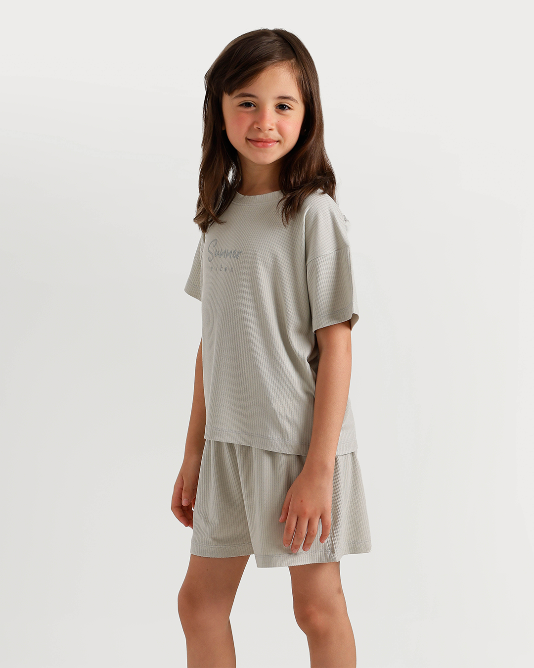 Cute girl in warm-colored pajamas