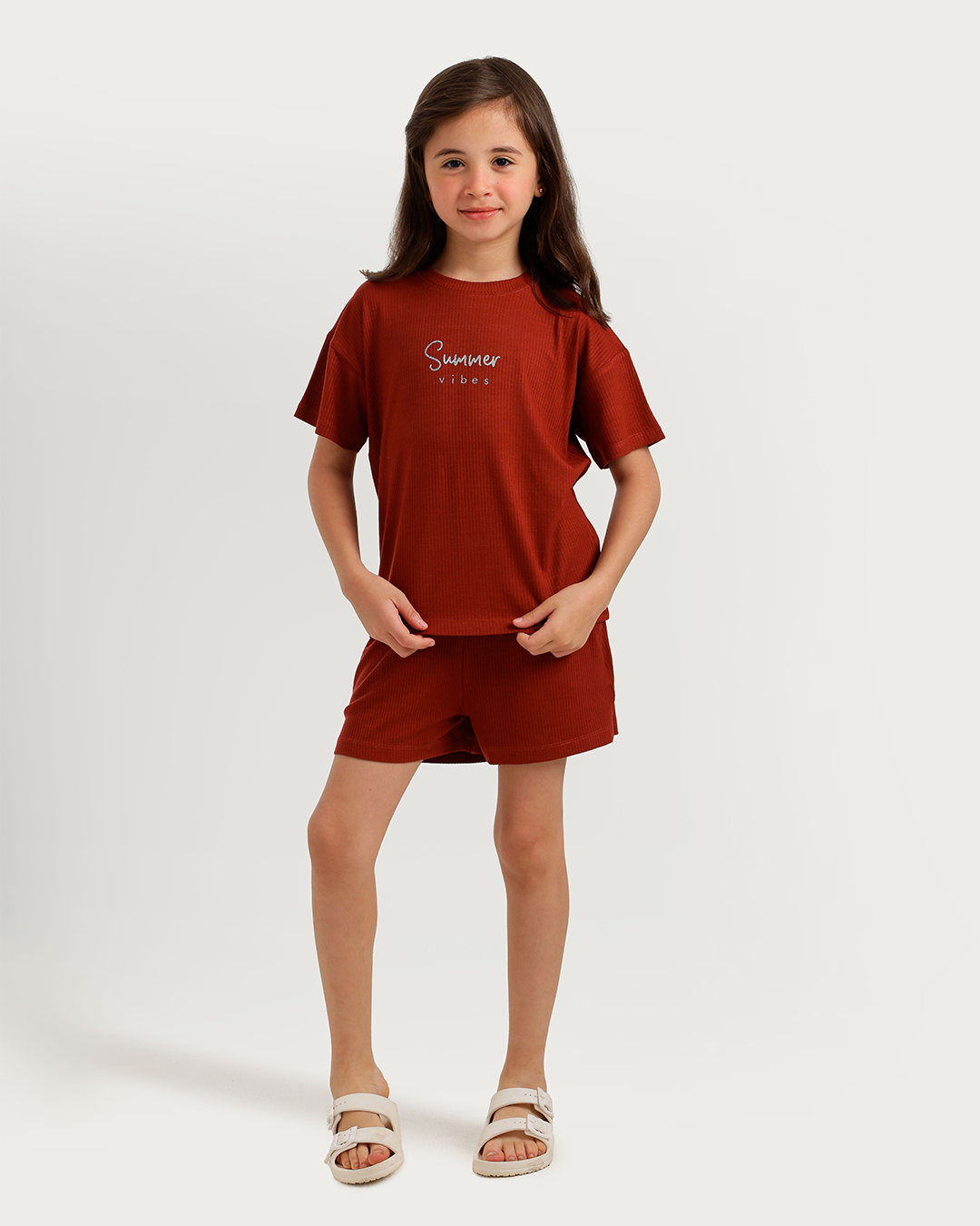 Cute girl in warm-colored pajamas