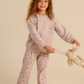 Girls' pajamas in warm colors with a floral print