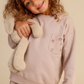 Girls' pajamas in warm colors with a floral print