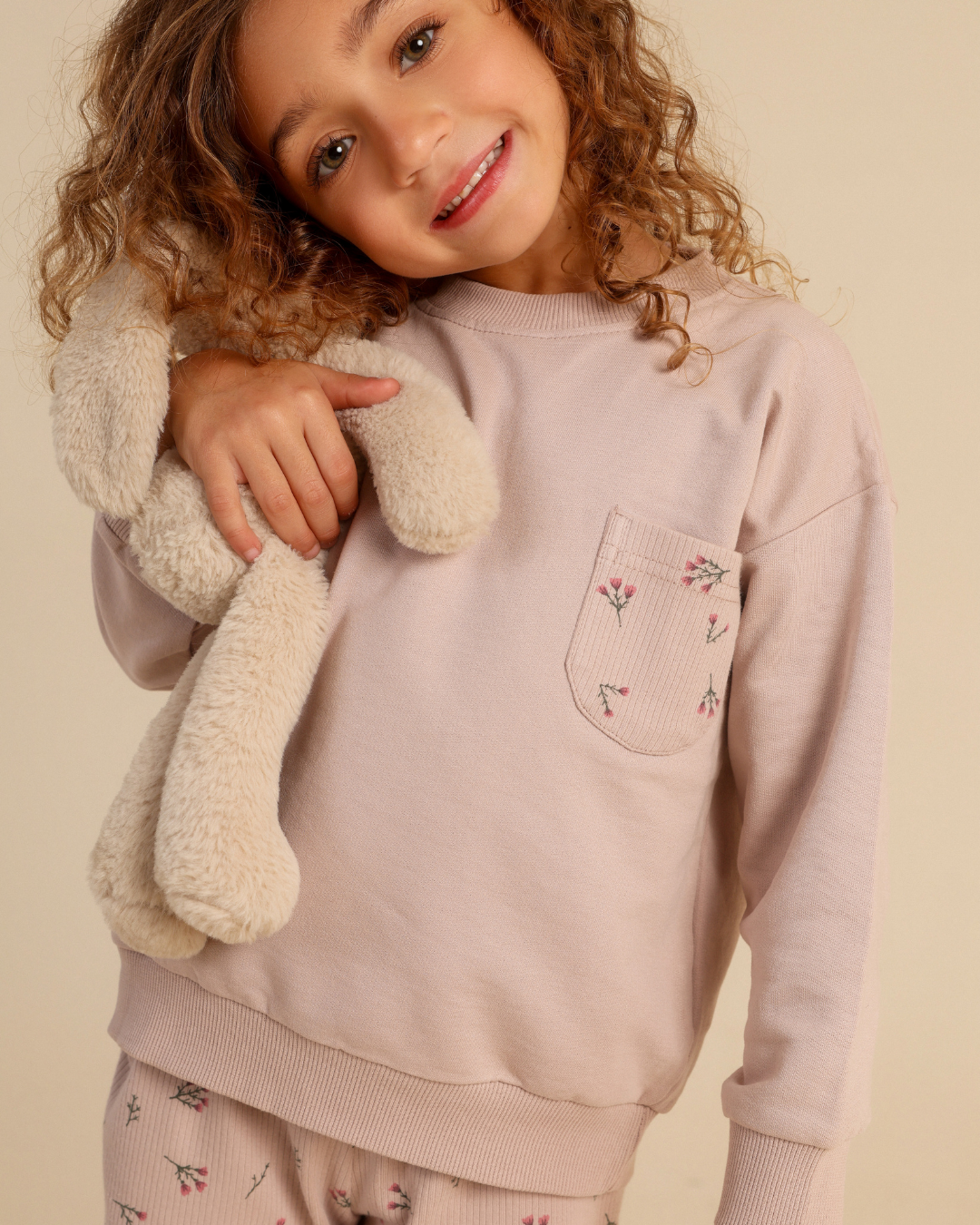 Girls' pajamas in warm colors with a floral print