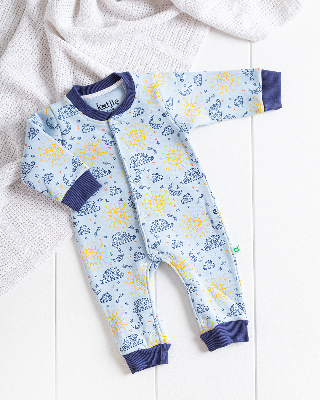 My children's jumpsuit with clouds, sun and moon