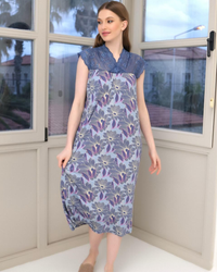 A short women's shirt with quarter sleeves and lace on the chest