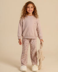 Girls' pajamas in warm colors with a floral print