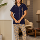 Women's pajamas, printed long trousers, buttoned T-shirt with hearts printed on the word