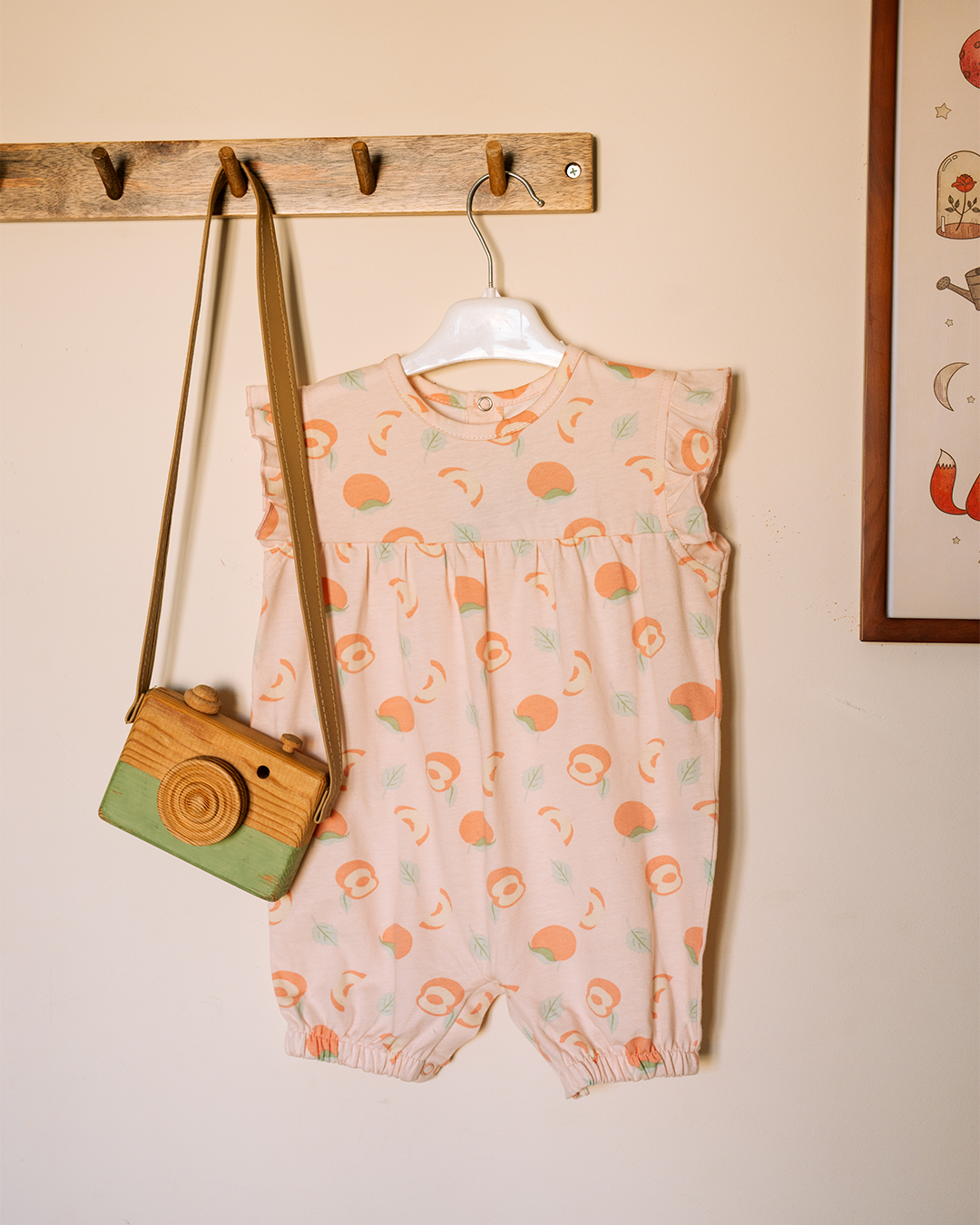 Baby romper in peach