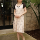 Women's short shirt with half sleeves, lace back, and floral lace