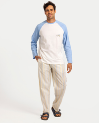 Men's pajama set with long sleeves and striped pants in spring colors