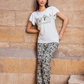 Women's pajamas, half-sleeve fan-print top, and olive-colored floral trousers