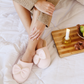 Slipper with a plush bow