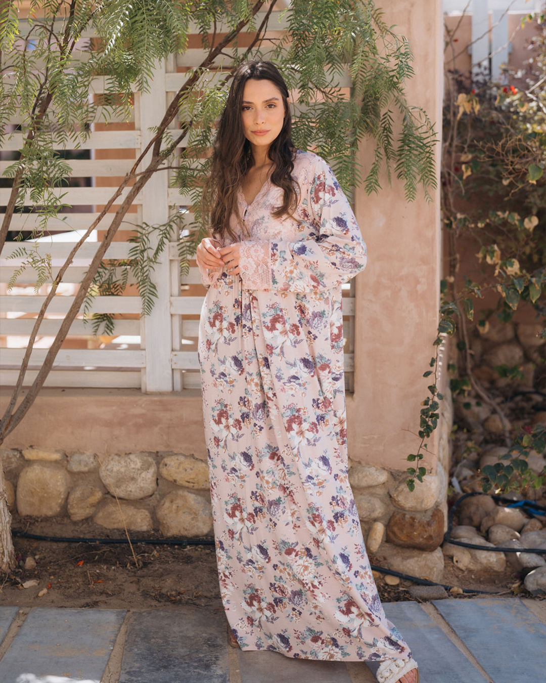 A women's galabiya, a wooded jantel, and a rose