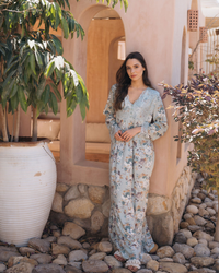 A women's galabiya, a wooded jantel, and a rose