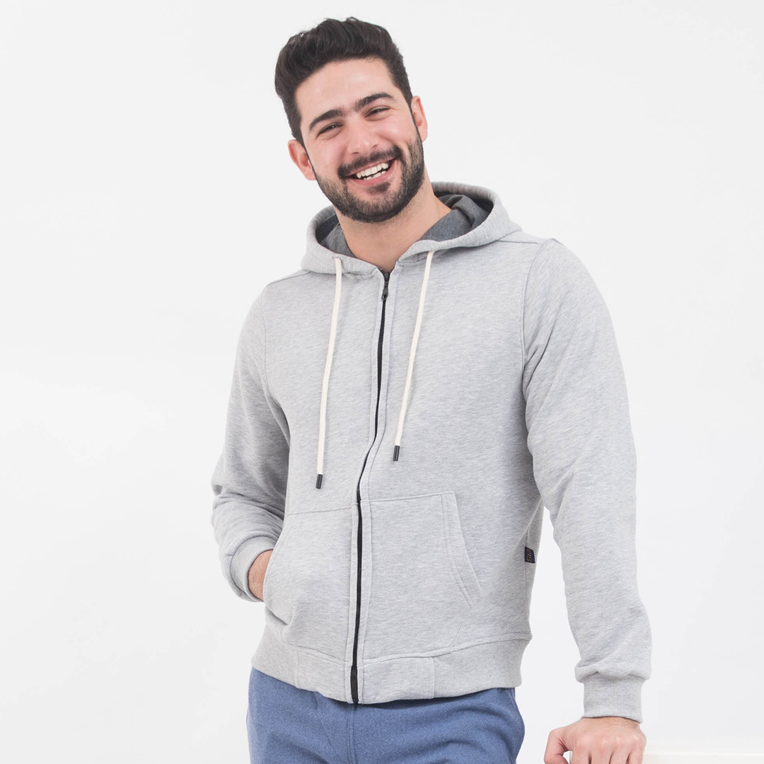 Sweatshirt with a zip and a cabochon