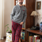 Men's pajamas with a button-up neck and checkered pants